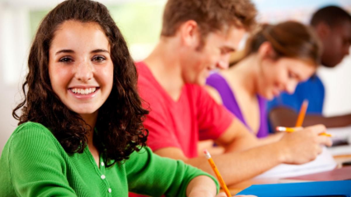 A girl sitting at her desk
