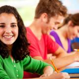A girl sitting at her desk