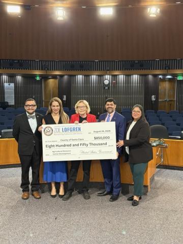 Rep. Lofgren presenting check to James R. Williams and Sylvia Arenas