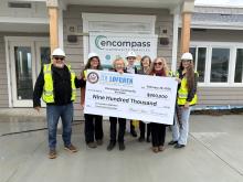 Rep. Lofgren presenting check to Encompass Community Services